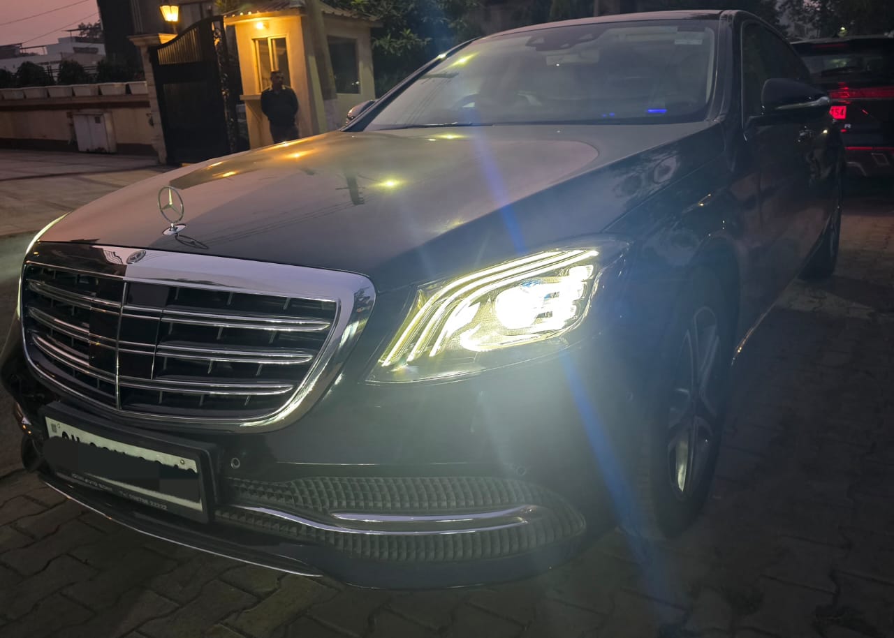 Mercedes-Benz S-Class front view at night with headlights on
